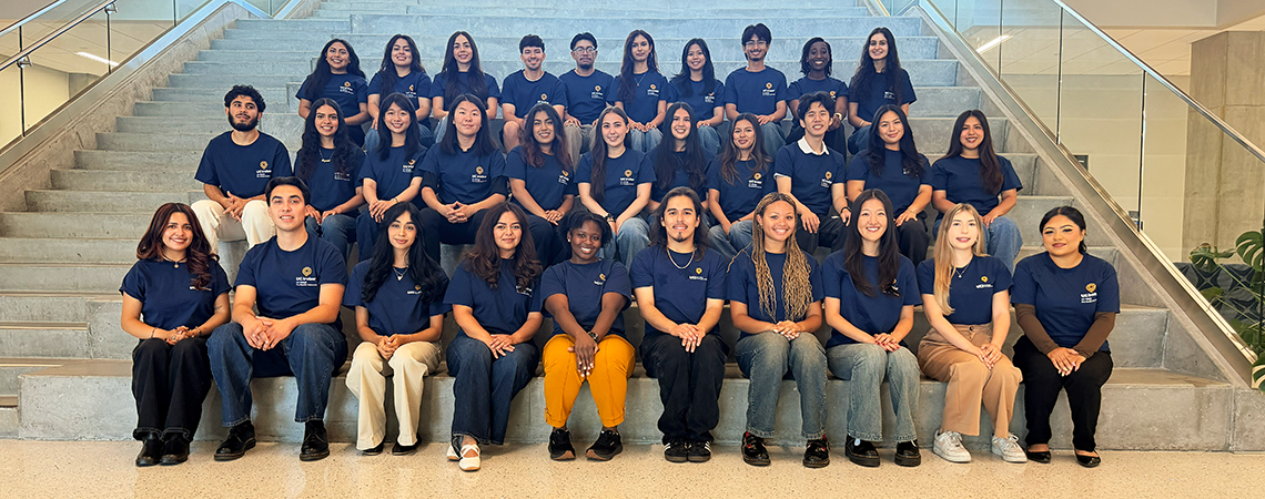 Photo of the 2026 cohort, group of students seating by stair steps